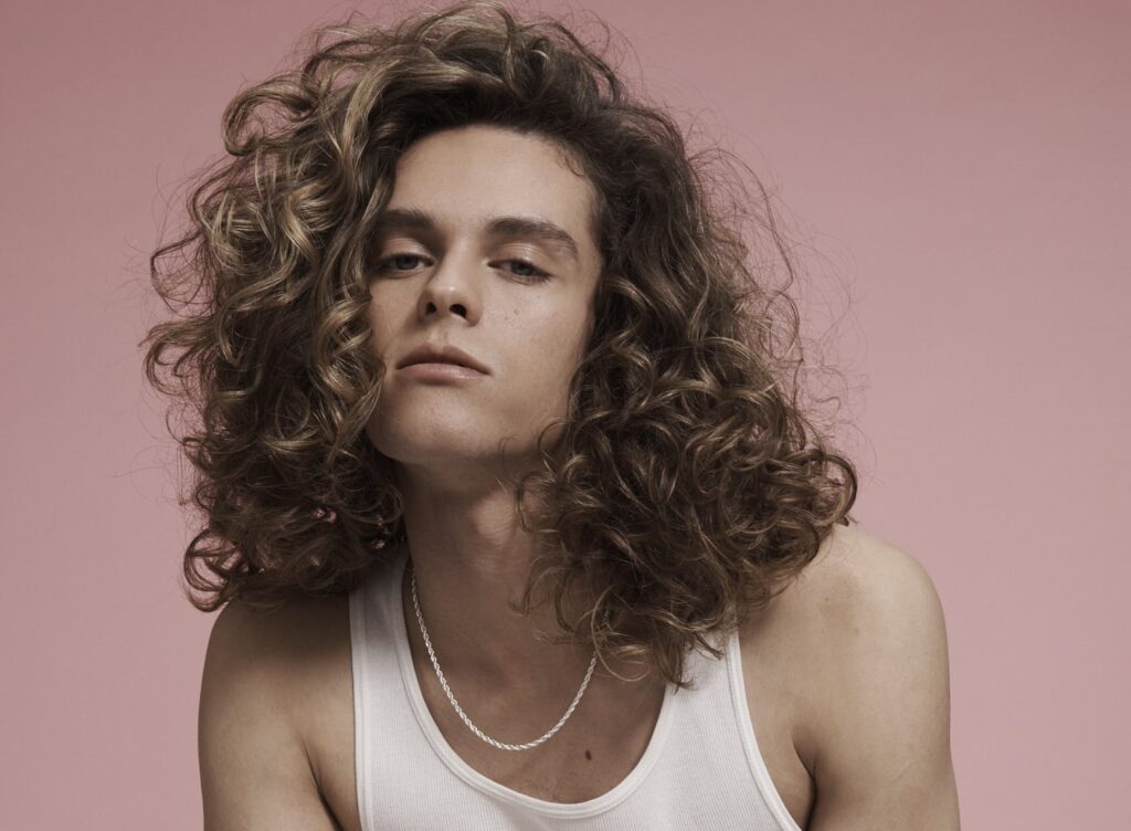 Sun-kissed highlights on curly hair