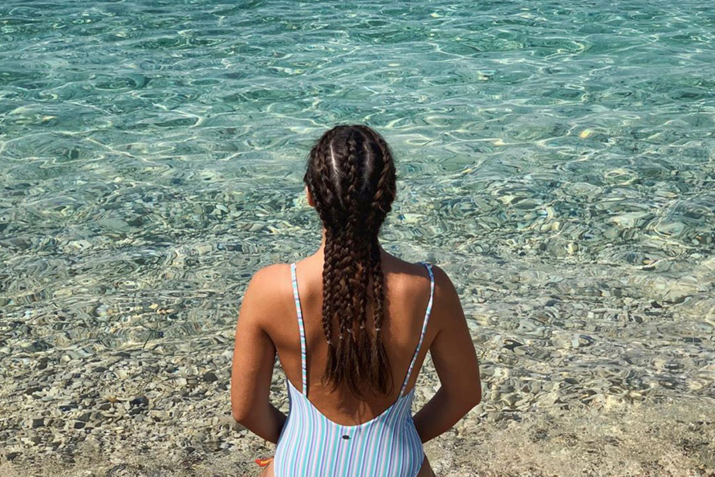 braided hair and sea