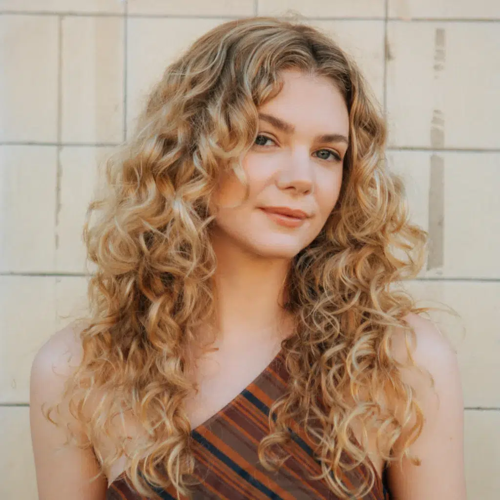 Blonde Highlights on a Long Curly Cut