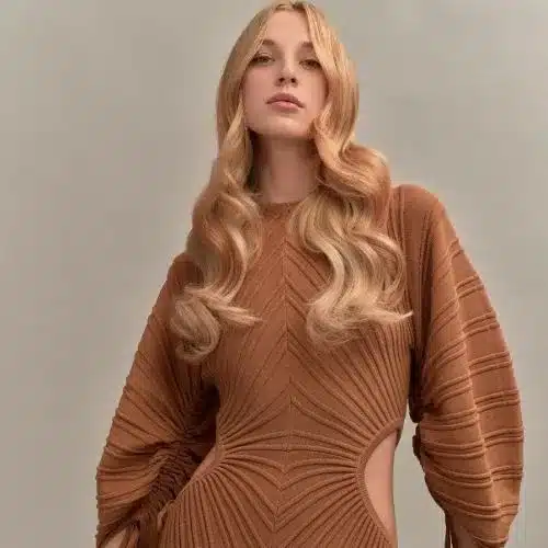 strawberry blonde hair or copper blonde with long waves