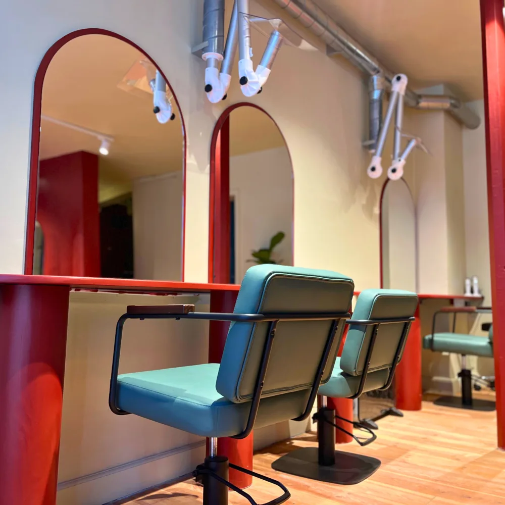 Inside Blue Tit Copenhagen, stylish comfortable chairs and pops of red.
